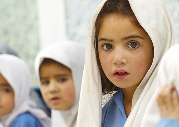 Schoolgirls in white headscarves
